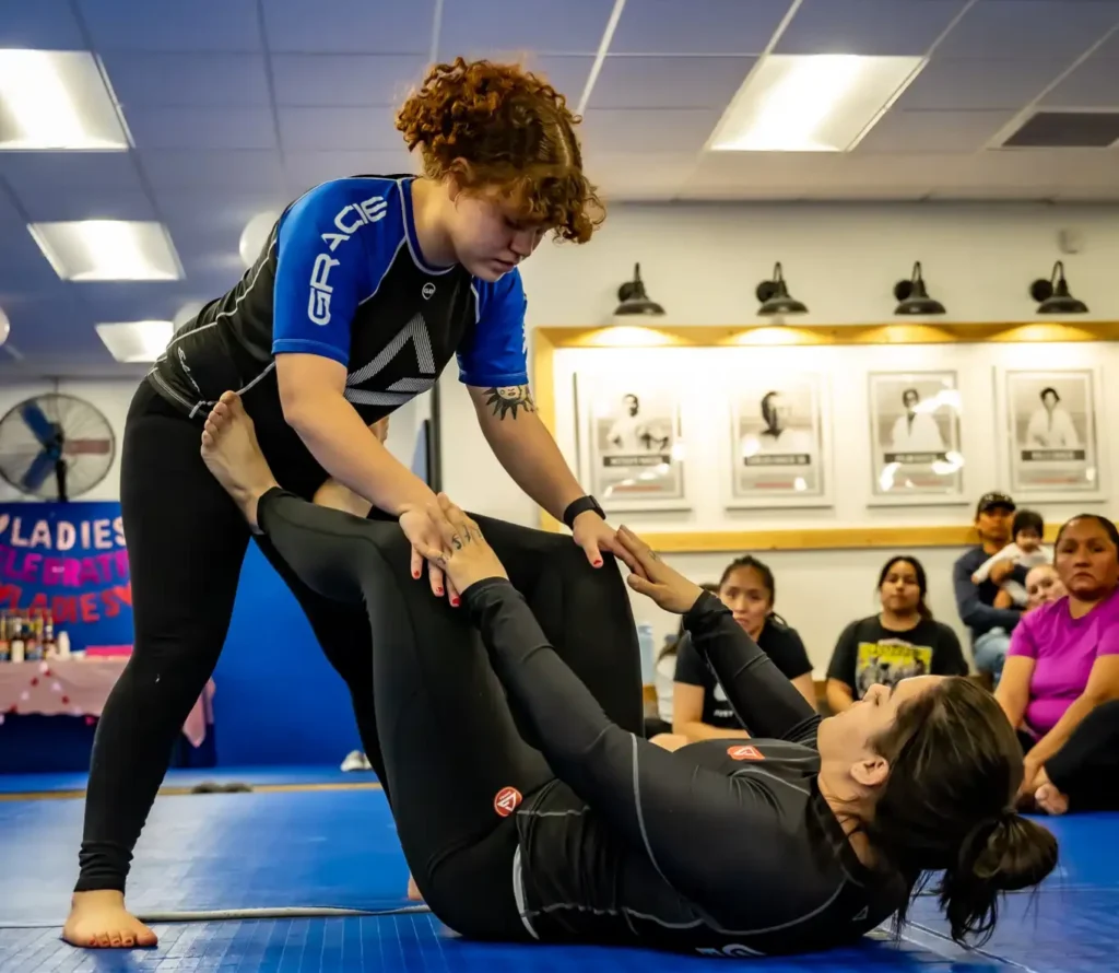 Moms fighting in jiu-jitsu class
