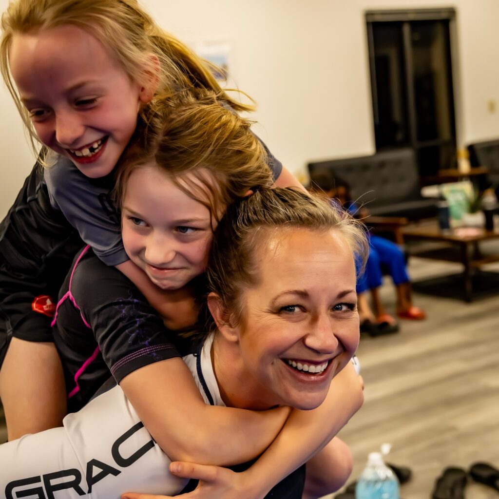 Moms fighting in jiu-jitsu class